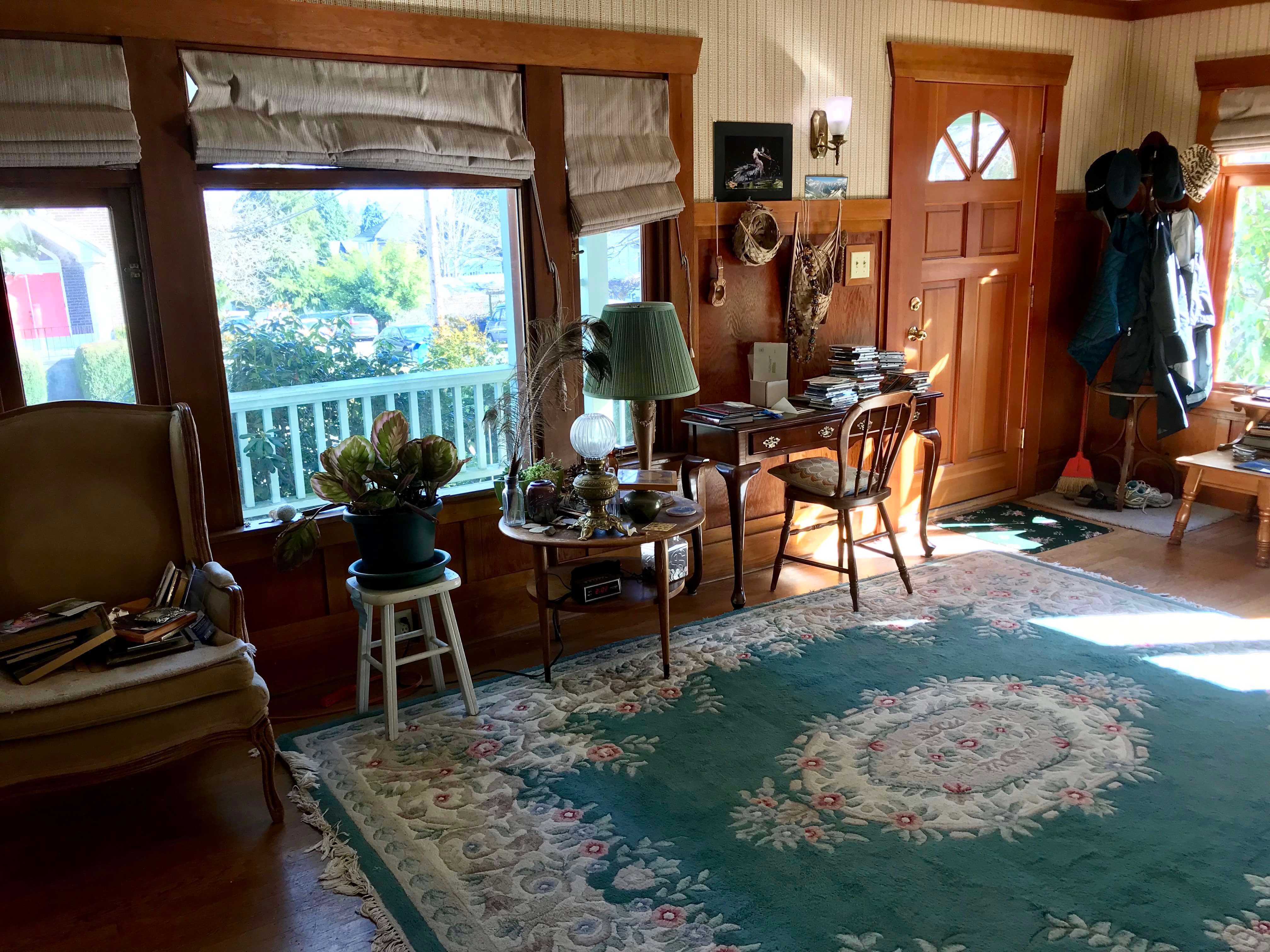 Outdated, dark, and cluttered living room, before using concierge