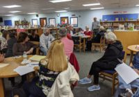 Neighbors listening at annual meeting